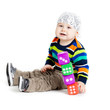 baby is playing with  toys over white background. Funny little k