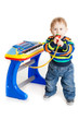 little boy and the keyboard on white background. funny boy baby.