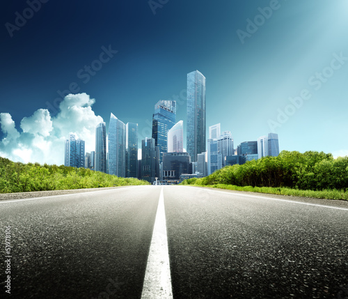 Photo: Asphalt road and modern city Asphalt road and modern city