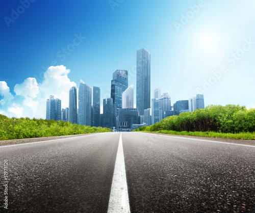 Photo: Asphalt road and modern city Asphalt road and modern city