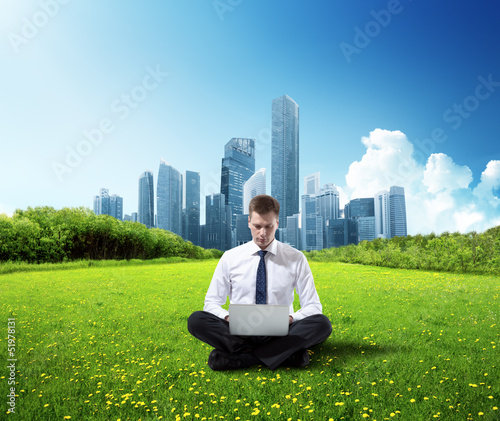Photo: business man working in park business man working in park