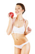 Foto: woman with white tapemeasure and red apple woman with white tapemeasure and red apple