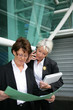 two senior businesswoman hammering-out a deal