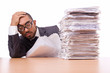 Busy businessman with lots of papers