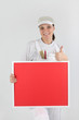 Foto: Female decorator with a board left blank for your message Female decorator with a board left blank for your message