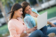 Friends using a laptop