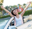 Happy woman with her new car