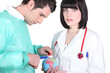 Photo: Doctors treating a mini-globe Doctors treating a mini-globe