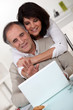 Couple in front of a laptop