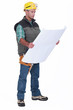 A foreman checking blueprints.