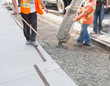 Photo: Pouring cement for new sidewalk Pouring cement for new sidewalk