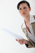 Woman with paper in hand