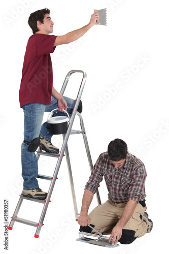Photo: tiler and apprentice working together tiler and apprentice working together