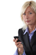 Mature businesswoman with a cellphone