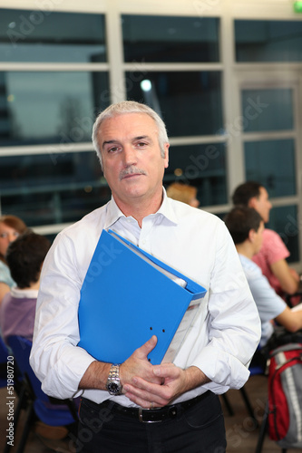 Photo: A teacher supervising an exam A teacher supervising an exam