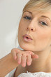 Photo: Blond girl blowing kisses Blond girl blowing kisses