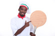Pizza chef showing his pizza loading peel
