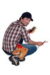 Photo: Electrician with a multimeter Electrician with a multimeter
