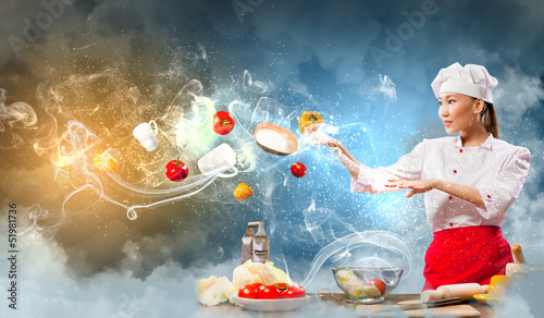 Photo: Asian female cooking with magic Asian female cooking with magic
