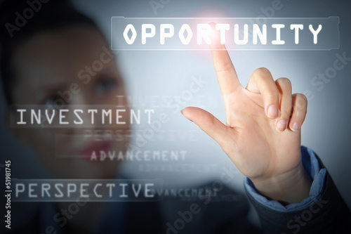 Photo: Business woman touching display Business woman touching display