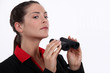 Businesswoman with binoculars