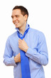 Foto: Businessman at home making his tie Businessman at home making his tie