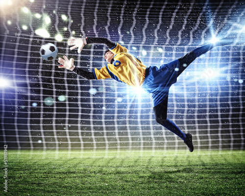 Photo: Goalkeeper catches the ball Goalkeeper catches the ball
