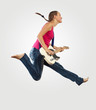 Photo: young woman playing on electro guitar and jumping young woman playing on electro guitar and jumping