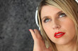 Foto: Woman listening to music on headphones Woman listening to music on headphones