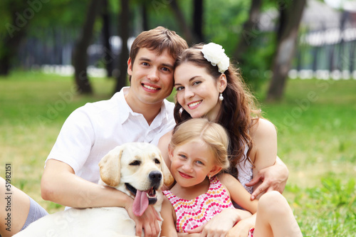Photo: Happy family having fun outdoors Happy family having fun outdoors