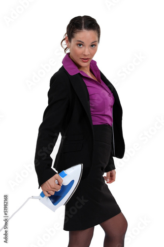 Photo: Businesswoman stood with iron Businesswoman stood with iron