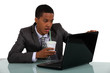 Foto: Businessman looking at his laptop Businessman looking at his laptop