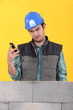 Builder reading a text message
