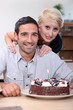 Photo: Couple with birthday cake Couple with birthday cake