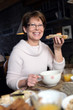 Photo: Woman eating a slice of bread Woman eating a slice of bread