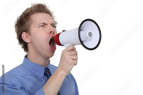 Photo: Man yelling into a megaphone Man yelling into a megaphone