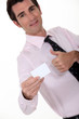 businessman holding a visit card