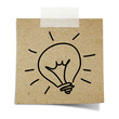 Photo: drawing light bulb taped recycle paper on white background drawing light bulb taped recycle paper on white background