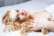 Beautiful woman lies on bed