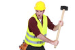 Tradesman hitting an object with a mallet