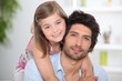 Foto: Girl hugging her dad Girl hugging her dad