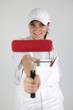 Photo: female painter holding a brush female painter holding a brush