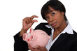 Photo: Businesswoman saving for a rainy day Businesswoman saving for a rainy day