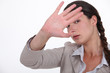 Woman trying to block out the camera