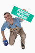 Photo: Man with a French wet paint sign Man with a French wet paint sign