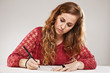 Female student writing on notebook