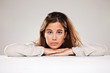 Portrait of a Pretty young woman leaning on a table