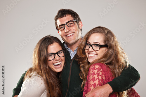 Photo: Three smart student friends looking with eyeglasses Three smart student friends looking with eyeglasses