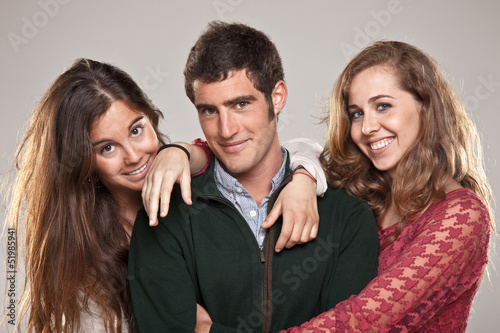 Photo: Three smart student friends looking camera Three smart student friends looking camera
