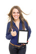 Cheerful female student showing tablet screen gesturing thumb up